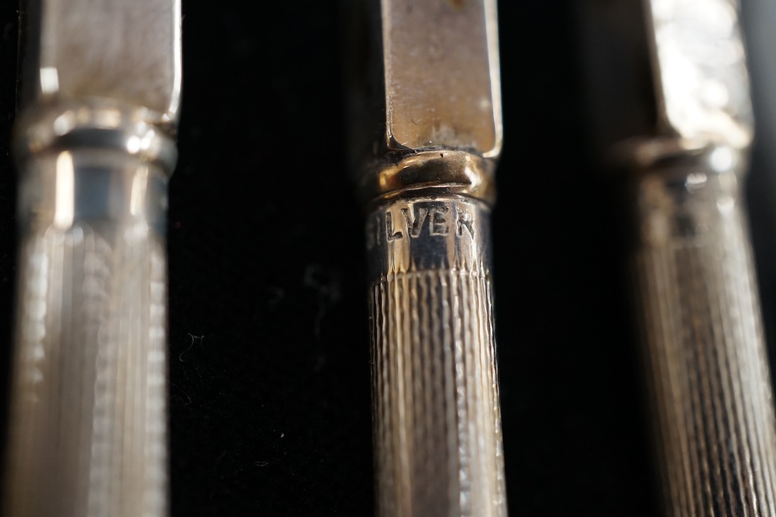An Elizabeth II George style piece silver mustard pot and salt by Da-mar Silverware, London, 1977, together with a sliver mounted glass tidy and a cased set of four sterling mounted bridge pencils.